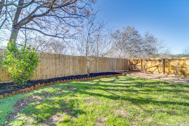 view of yard featuring a fenced backyard