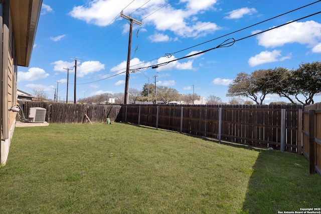 view of yard featuring cooling unit and a fenced backyard