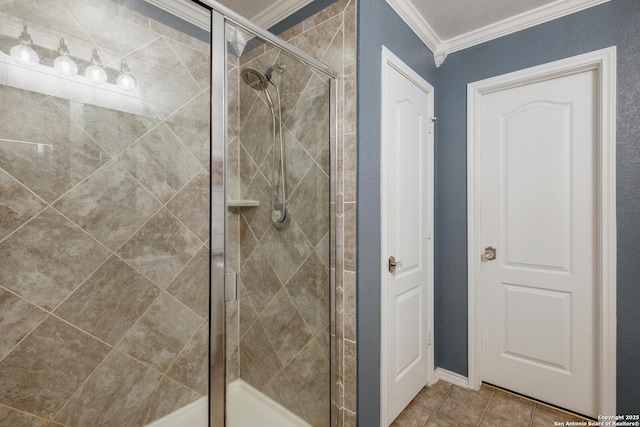 bathroom with ornamental molding, a stall shower, and tile patterned flooring
