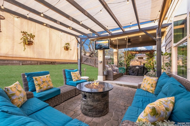 view of patio with an outdoor living space with a fire pit, fence, and a pergola