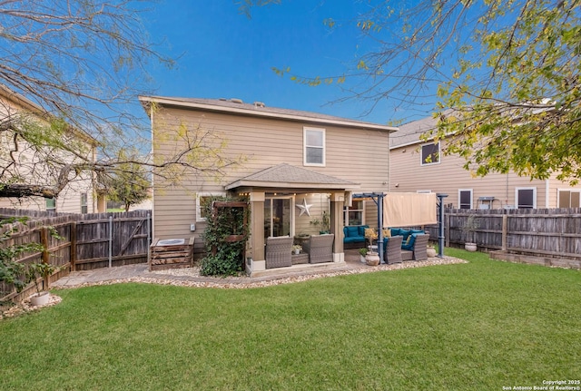 back of property with a fenced backyard, an outdoor hangout area, and a yard