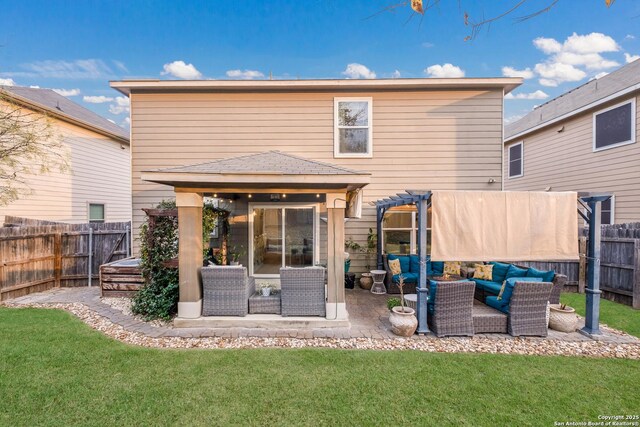 back of house featuring an outdoor hangout area, a lawn, a fenced backyard, and a pergola