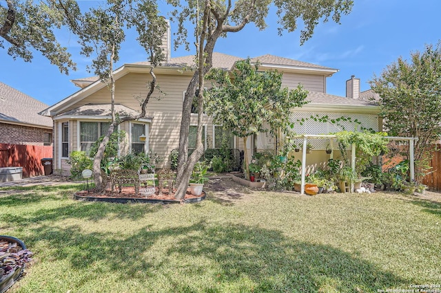 13026 Gordons Knl, San Antonio, TX 78253 - back of property featuring fence, a chimney, and a lawn