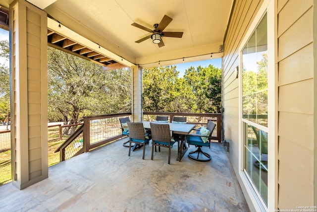 exterior space with a ceiling fan