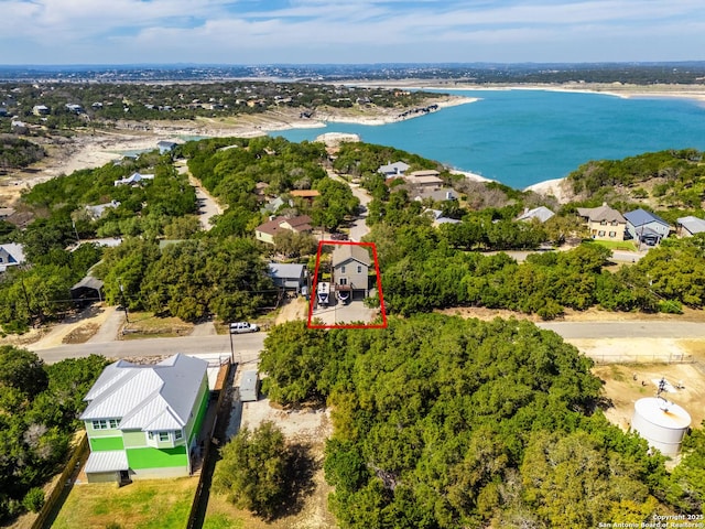 birds eye view of property with a water view