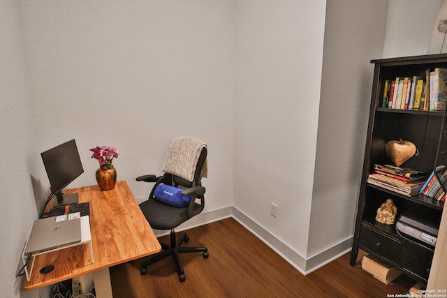 home office featuring dark wood-style flooring and baseboards