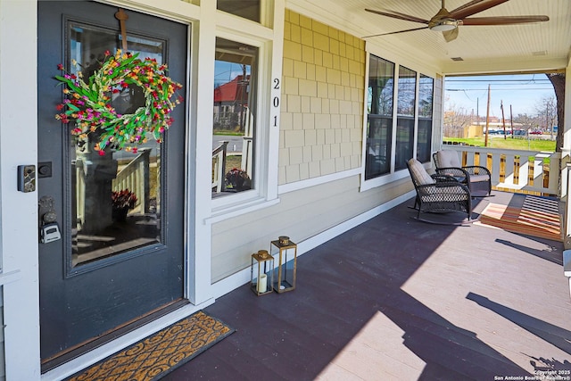 exterior space featuring a ceiling fan and covered porch