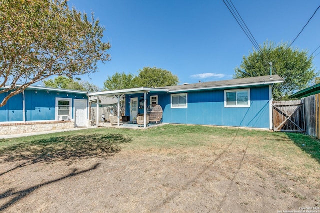 exterior space featuring a yard, a patio area, and fence