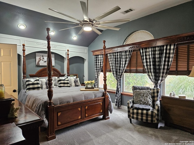 bedroom with carpet flooring, vaulted ceiling, and visible vents