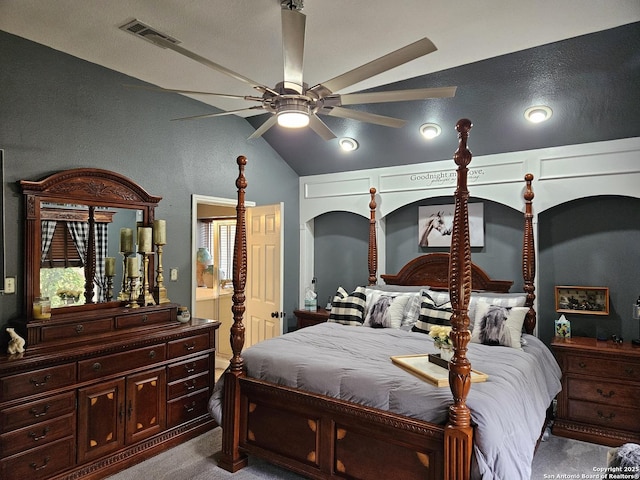 bedroom with lofted ceiling, visible vents, dark colored carpet, and a ceiling fan