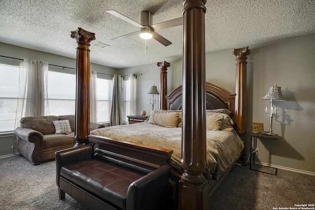 carpeted bedroom featuring a textured ceiling, ornate columns, a ceiling fan, and baseboards