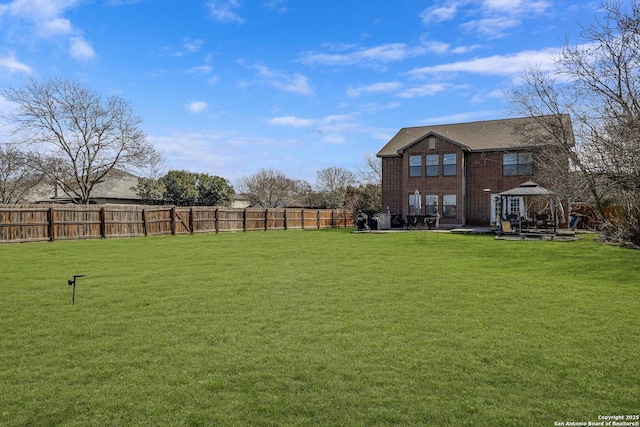 view of yard featuring a gazebo, a fenced backyard, and a patio