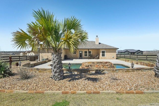 view of swimming pool featuring a fenced backyard, a fenced in pool, and a patio