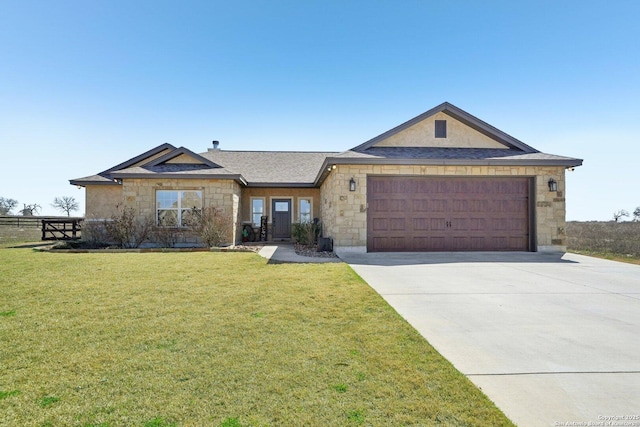 single story home with an attached garage, stone siding, driveway, and a front lawn