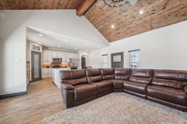 living room with arched walkways, high vaulted ceiling, recessed lighting, wood ceiling, and beam ceiling