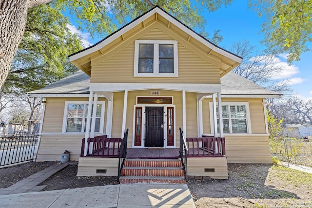 bungalow with covered porch and fence