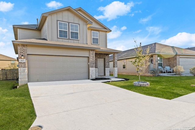 view of front facade with brick siding, an attached garage, board and batten siding, a front yard, and driveway