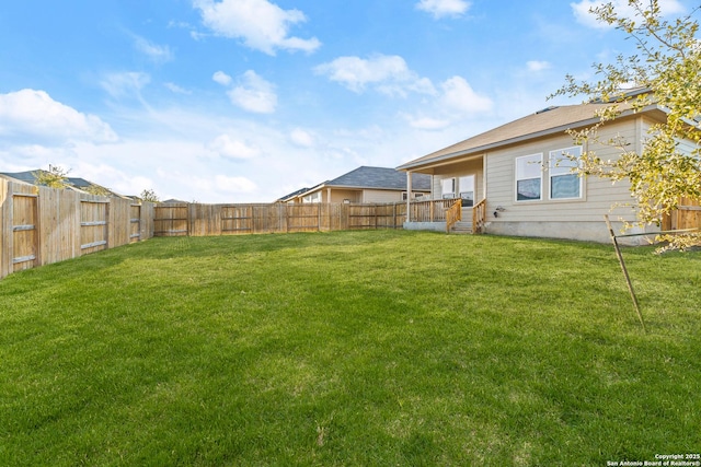 view of yard with a fenced backyard