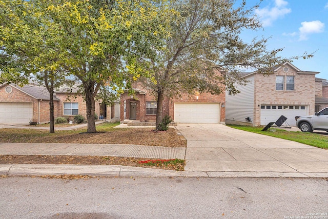 view of front of property with concrete driveway and brick siding