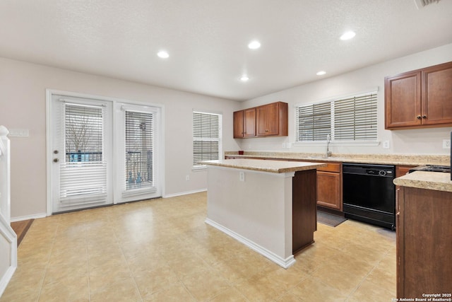 kitchen with a healthy amount of sunlight, a sink, a kitchen island, and dishwasher