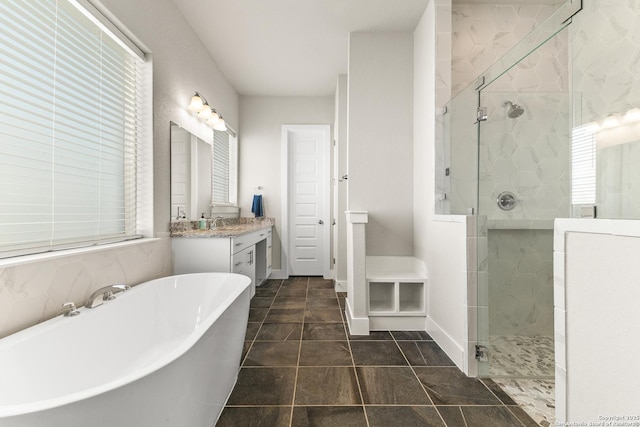 full bath with a soaking tub, baseboards, a shower stall, and vanity