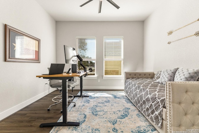 bedroom featuring ceiling fan, baseboards, and wood finished floors