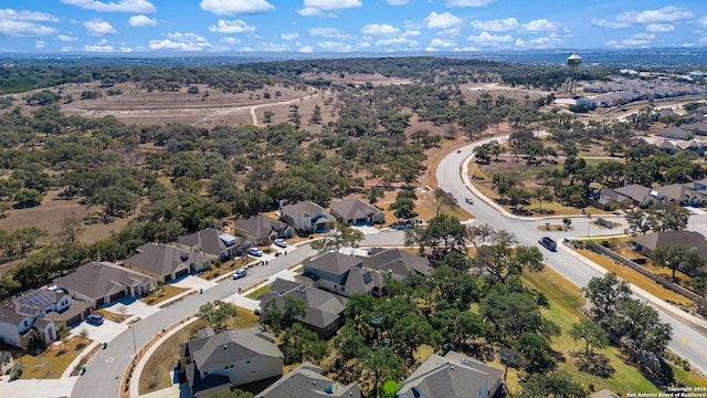 birds eye view of property with a residential view