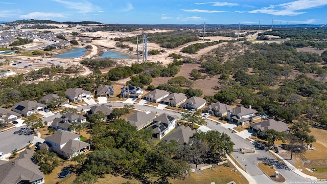 bird's eye view with a residential view and a water view