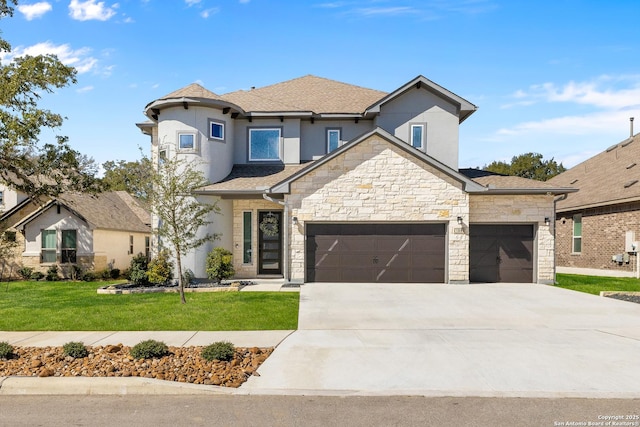 view of front of house with an attached garage, a shingled roof, concrete driveway, stone siding, and a front lawn