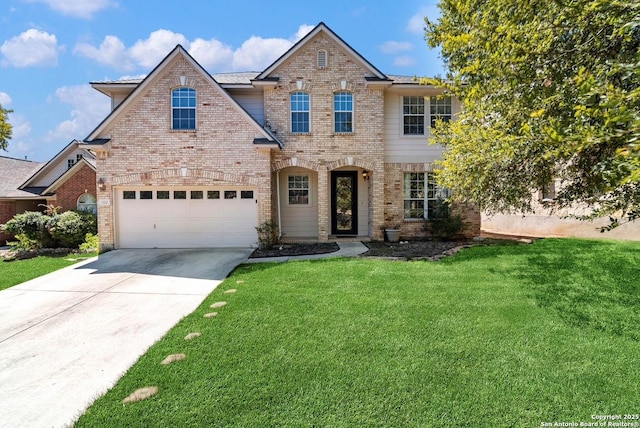 view of front of home featuring concrete driveway, brick siding, and a front yard