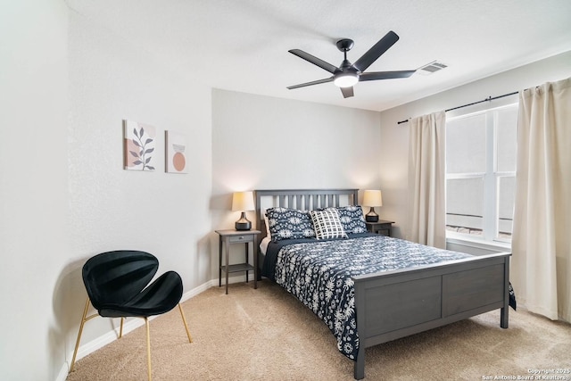 bedroom with a ceiling fan, carpet, visible vents, and baseboards