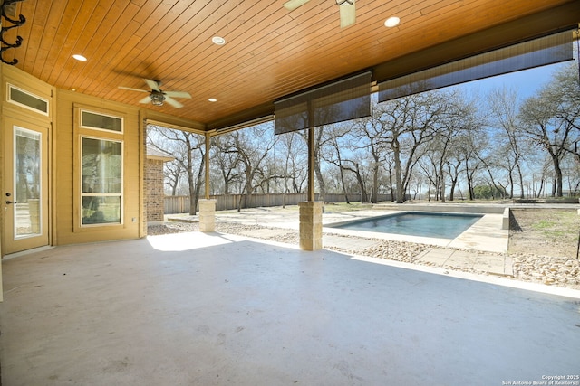 exterior space with a patio area, a ceiling fan, and fence