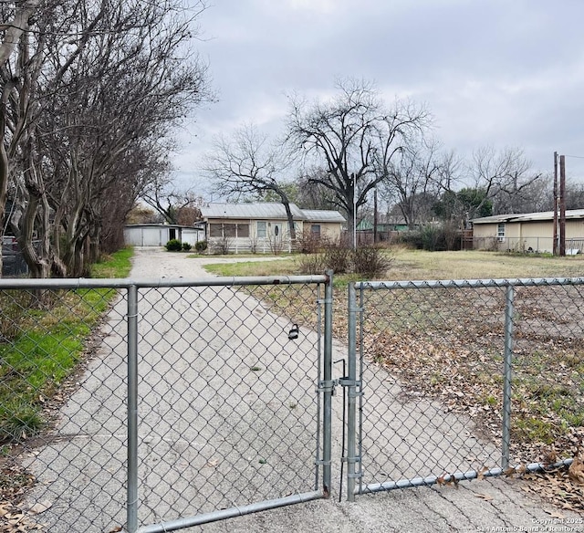 view of gate with fence