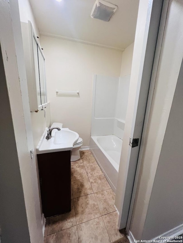 full bathroom featuring toilet, tile patterned flooring, and vanity