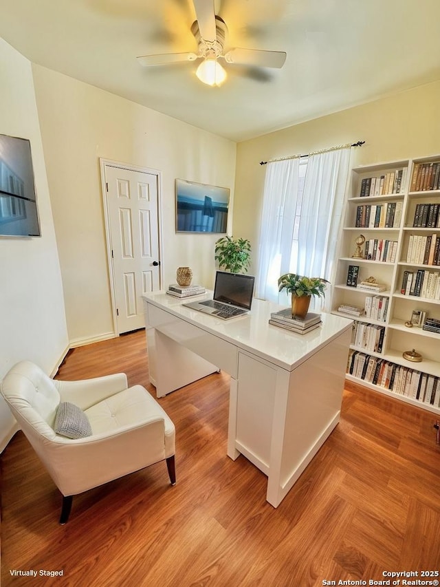 office featuring ceiling fan and light wood-type flooring