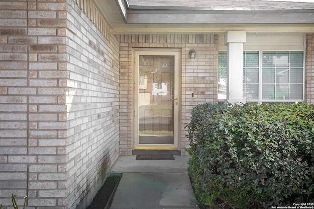 entrance to property with brick siding