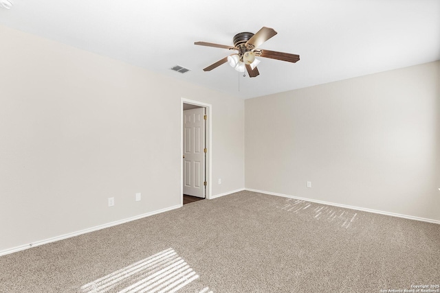 empty room featuring baseboards, visible vents, ceiling fan, and carpet flooring