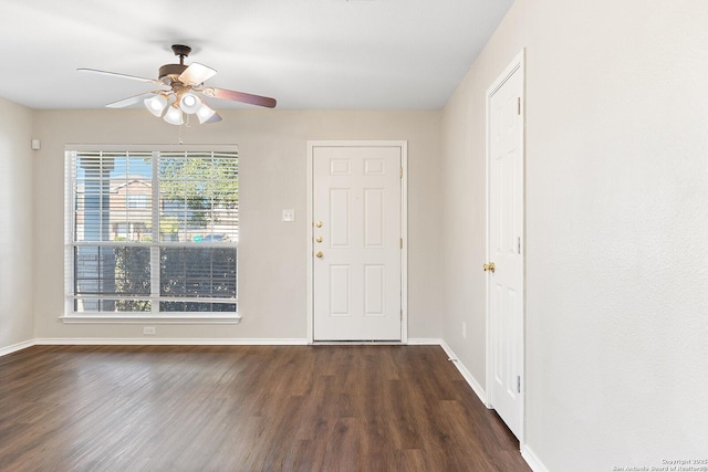 entrance foyer featuring a ceiling fan, baseboards, and wood finished floors