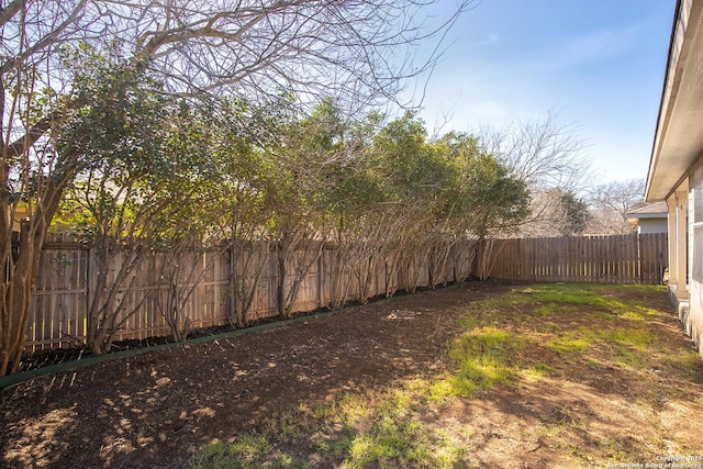 view of yard with a fenced backyard