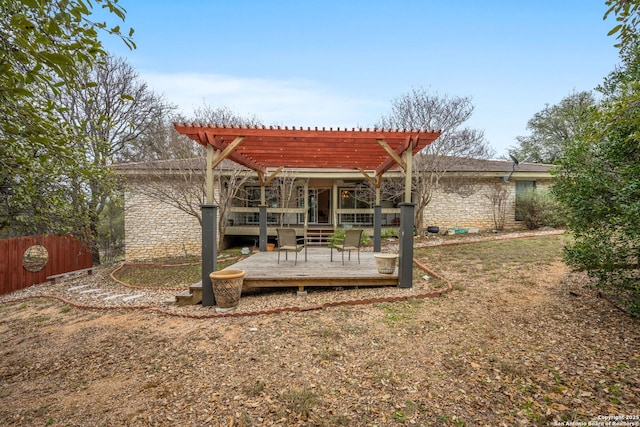 view of yard featuring fence, a deck, and a pergola