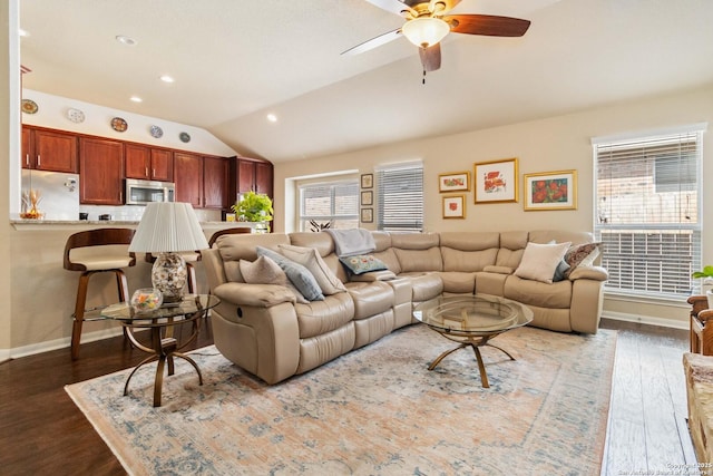 living room featuring baseboards, a ceiling fan, lofted ceiling, dark wood-style flooring, and recessed lighting