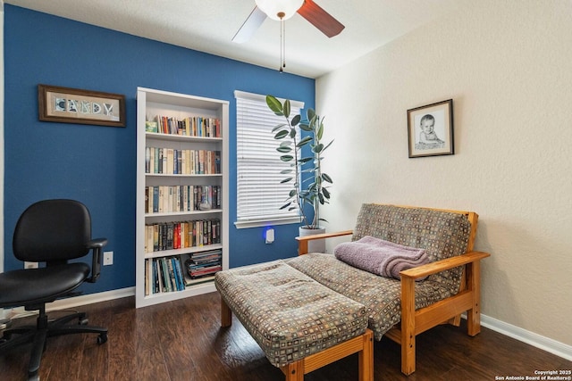 sitting room featuring a ceiling fan, baseboards, and wood finished floors