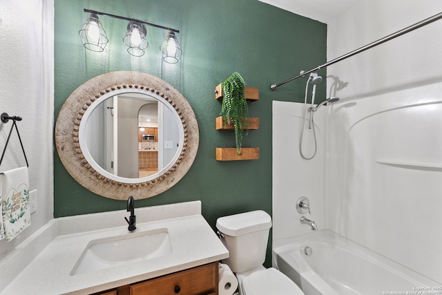 full bath with toilet, a textured wall, bathing tub / shower combination, and vanity