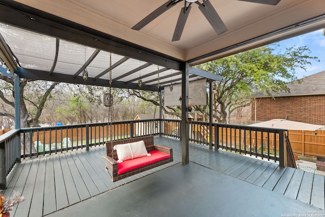 wooden terrace with a ceiling fan