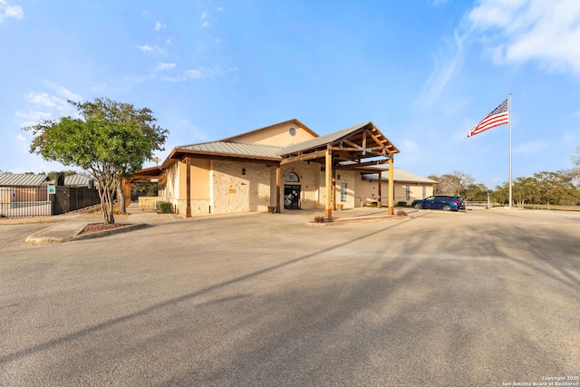 view of front of property with fence and stucco siding