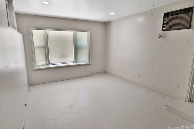 spare room featuring concrete flooring and recessed lighting