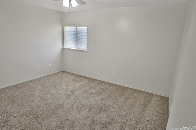 carpeted empty room featuring ceiling fan