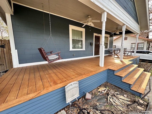 wooden deck featuring fence and a ceiling fan