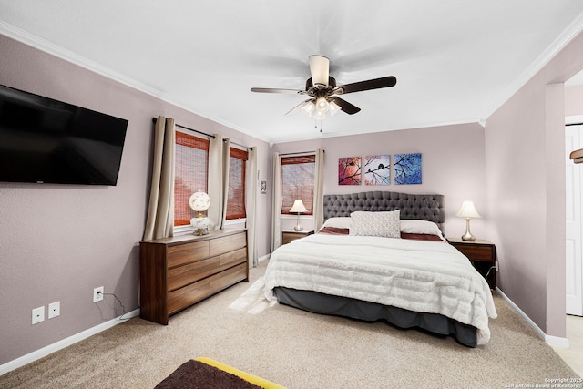 bedroom with baseboards, carpet floors, ceiling fan, and crown molding