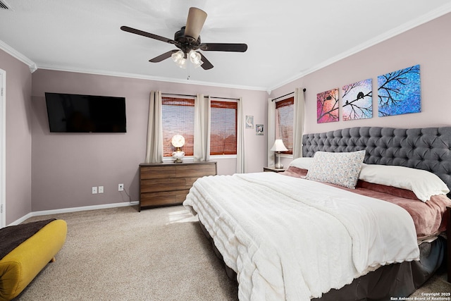 carpeted bedroom with baseboards, a ceiling fan, and crown molding